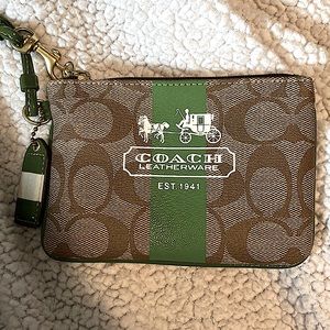 Coach wristlet wallet. Mint condition! Green detailing with plaid interior